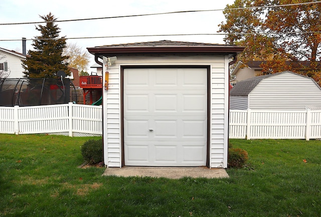 garage with a yard