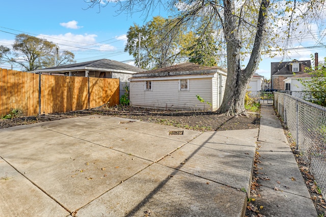 view of patio / terrace featuring an outbuilding and a garage