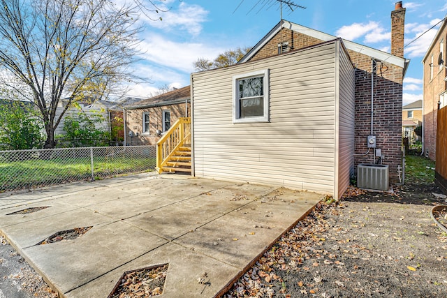 view of home's exterior featuring central AC and a patio area