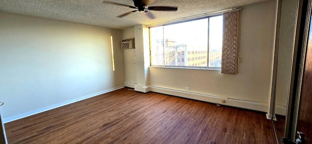 unfurnished bedroom featuring baseboards, wood finished floors, baseboard heating, a textured ceiling, and an AC wall unit