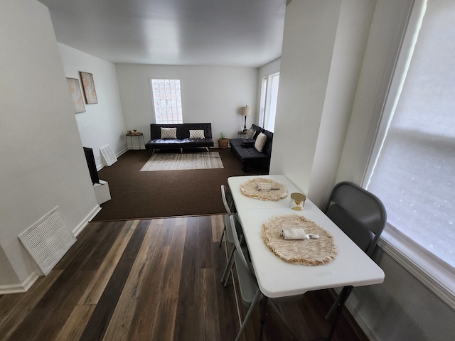 dining space featuring dark hardwood / wood-style floors