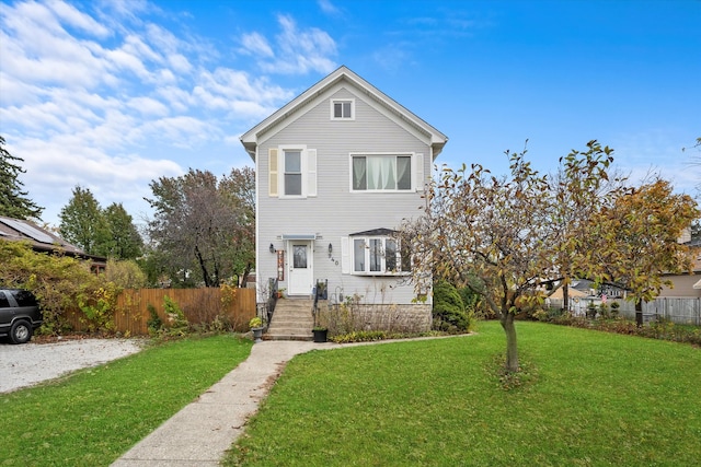 front facade featuring a front lawn