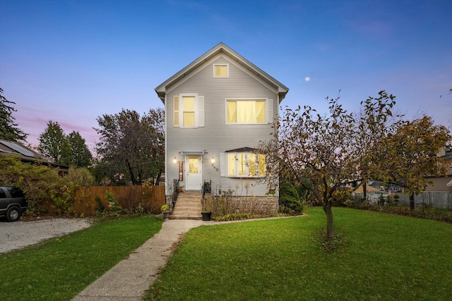 view of front of home with a lawn