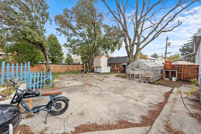 view of patio with an outbuilding