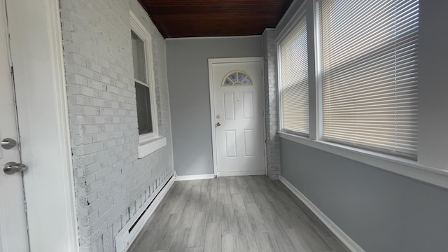 doorway to property with a baseboard radiator