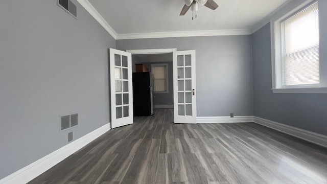 unfurnished room with crown molding, dark wood-type flooring, ceiling fan, and french doors