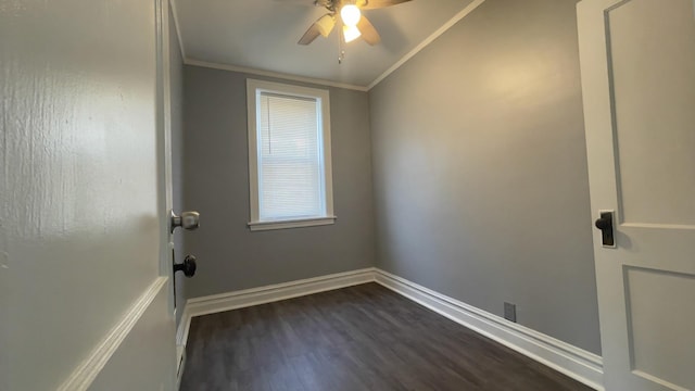 spare room featuring crown molding, dark wood-type flooring, and ceiling fan