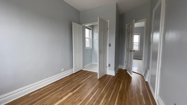 unfurnished bedroom featuring dark wood-type flooring