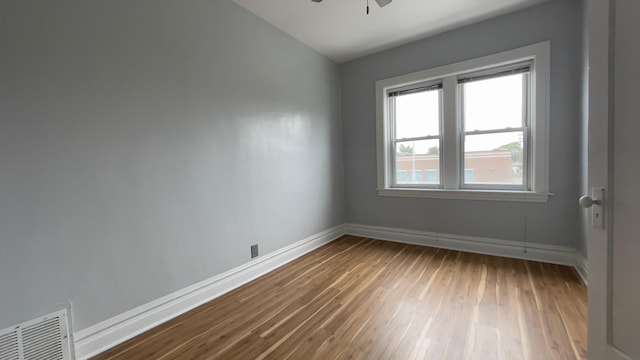 unfurnished room featuring hardwood / wood-style flooring and ceiling fan