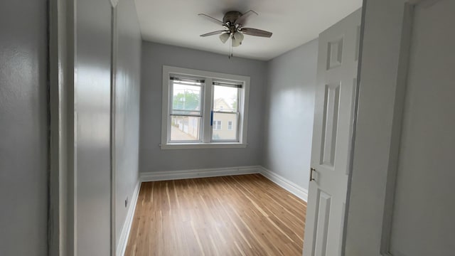 empty room featuring ceiling fan and light wood-type flooring