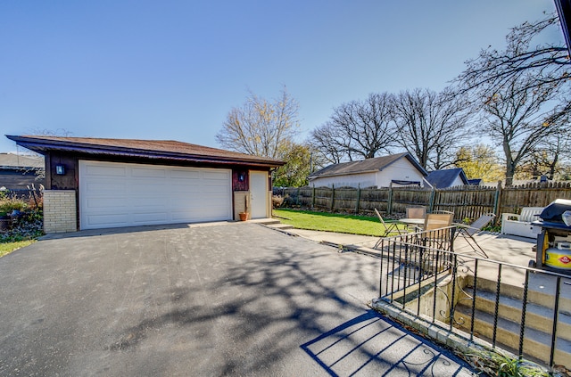 garage featuring a yard