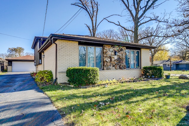 view of side of home featuring a lawn