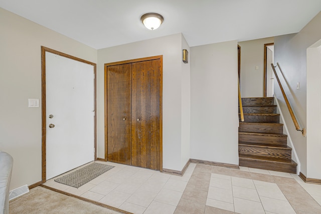 foyer with light tile patterned flooring