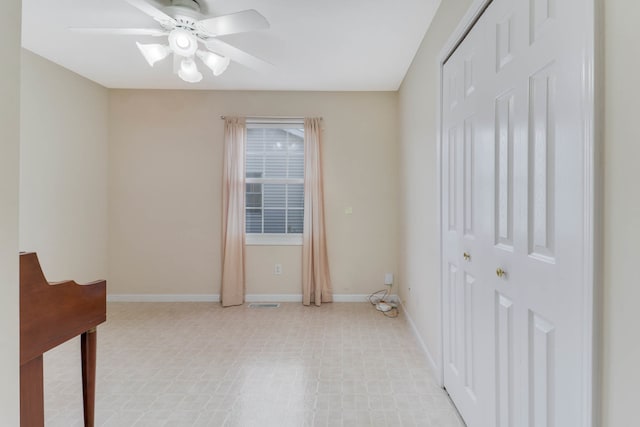 spare room with ceiling fan