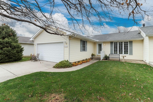 ranch-style home with a front yard and a garage