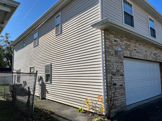 view of property exterior featuring a garage