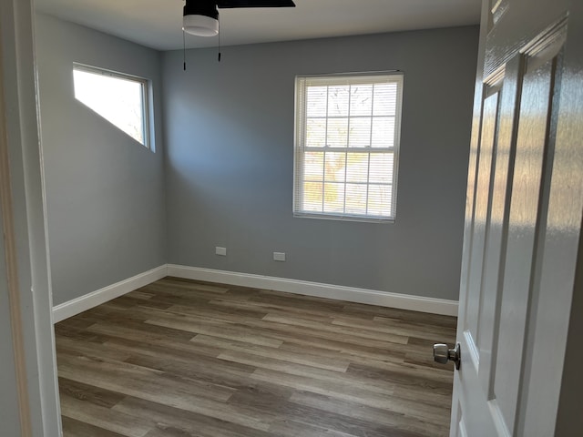 empty room featuring hardwood / wood-style floors and ceiling fan