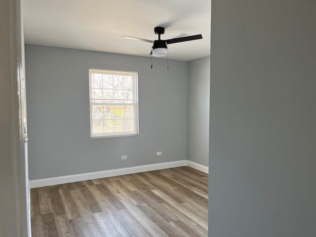 empty room featuring ceiling fan and light wood-type flooring