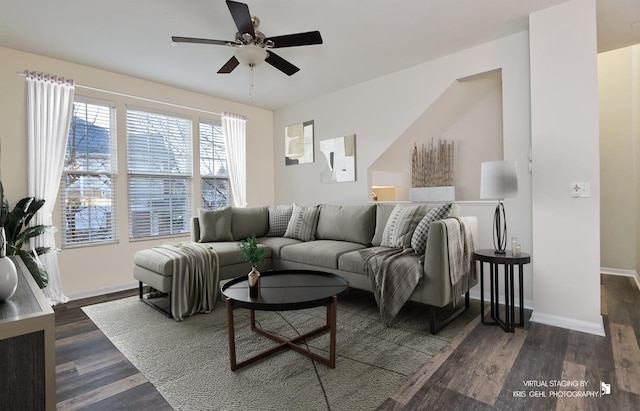 living room featuring dark hardwood / wood-style floors and ceiling fan