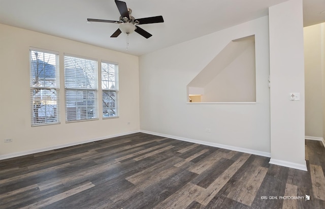 empty room featuring ceiling fan and dark wood-type flooring