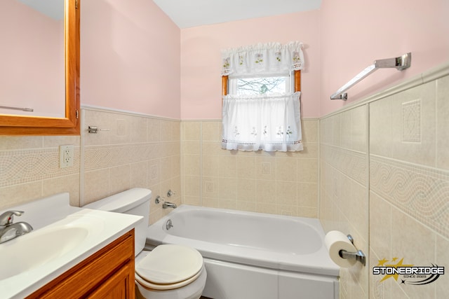 bathroom with a bathtub, toilet, tile walls, and vanity