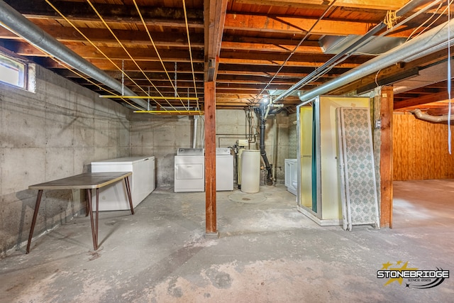 basement with refrigerator and separate washer and dryer