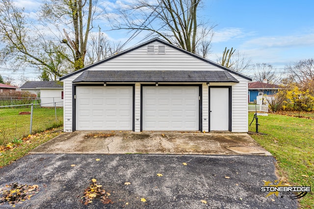 garage featuring a lawn