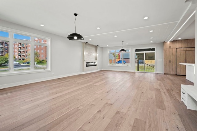 unfurnished living room featuring light hardwood / wood-style floors