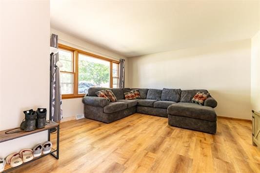 living room with light hardwood / wood-style flooring