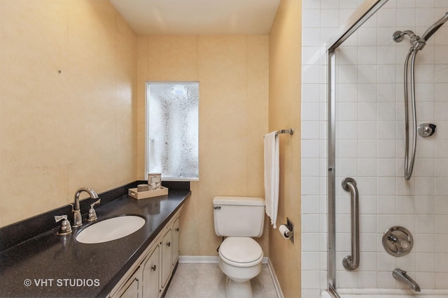 bathroom featuring toilet, vanity, and tile patterned floors