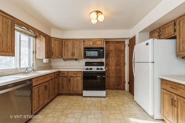 kitchen featuring sink and white appliances