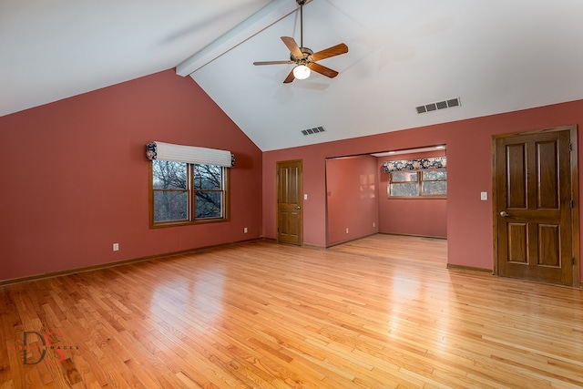 unfurnished living room with ceiling fan, beam ceiling, light wood-type flooring, and high vaulted ceiling