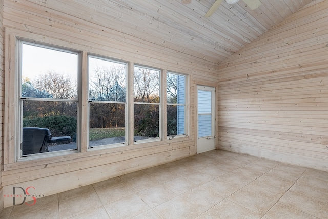 unfurnished sunroom featuring vaulted ceiling, ceiling fan, and wood ceiling