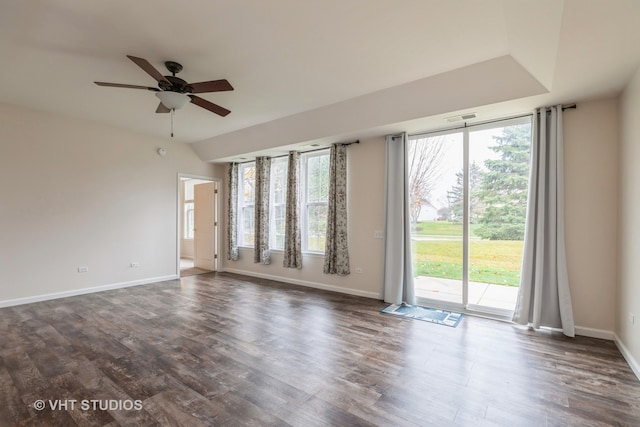 empty room featuring ceiling fan and dark wood-type flooring