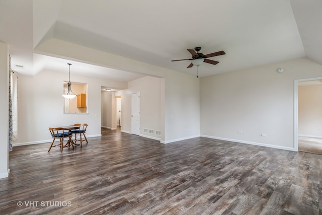 living room featuring ceiling fan and dark wood-type flooring