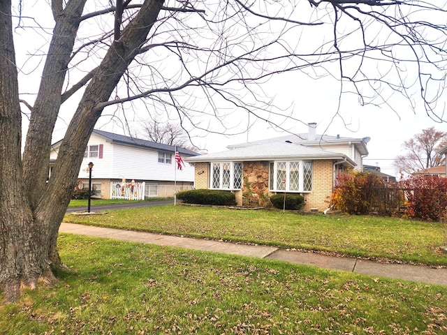 split level home with a front yard