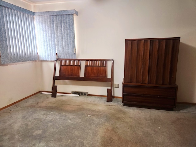 unfurnished bedroom with light colored carpet