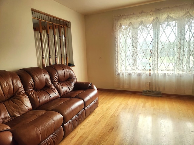 living room with light hardwood / wood-style floors