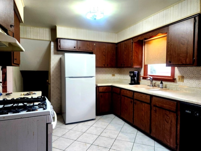 kitchen with white appliances, ventilation hood, sink, decorative backsplash, and light tile patterned floors