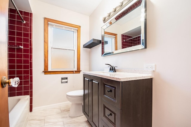 full bathroom featuring vanity, toilet, and tiled shower / bath