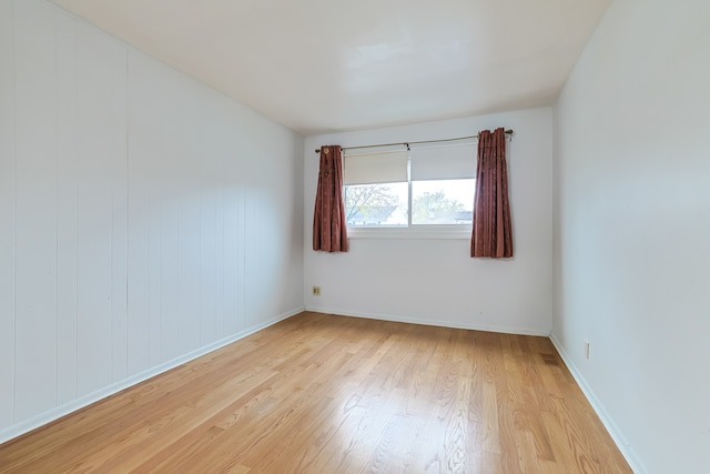 spare room with light wood-type flooring