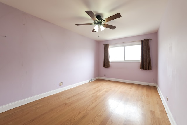 spare room with ceiling fan and light hardwood / wood-style floors