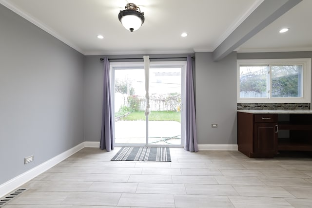 doorway to outside with crown molding