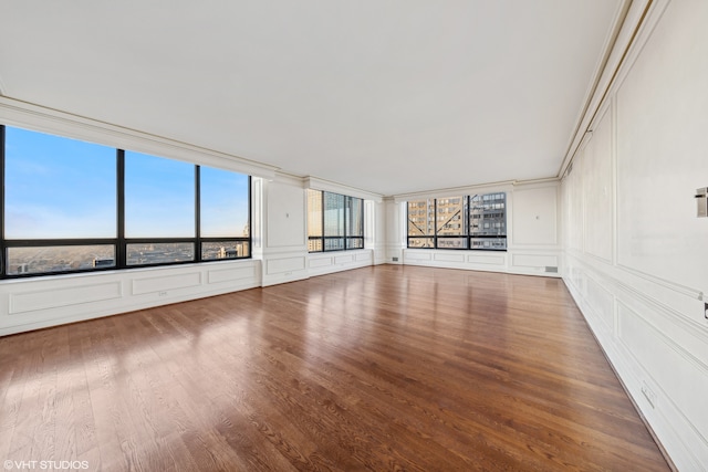 empty room with hardwood / wood-style floors