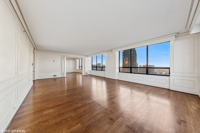 unfurnished living room with hardwood / wood-style flooring