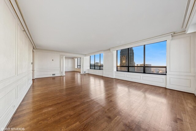 180 E Pearson St Unit 4901, Chicago, IL 60611 - unfurnished living room featuring a decorative wall and wood finished floors