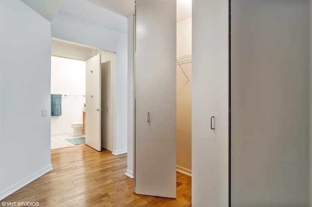 hallway with light wood-type flooring