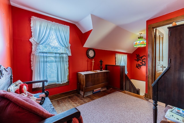 sitting room with hardwood / wood-style floors and lofted ceiling