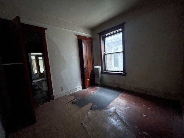 empty room featuring radiator heating unit