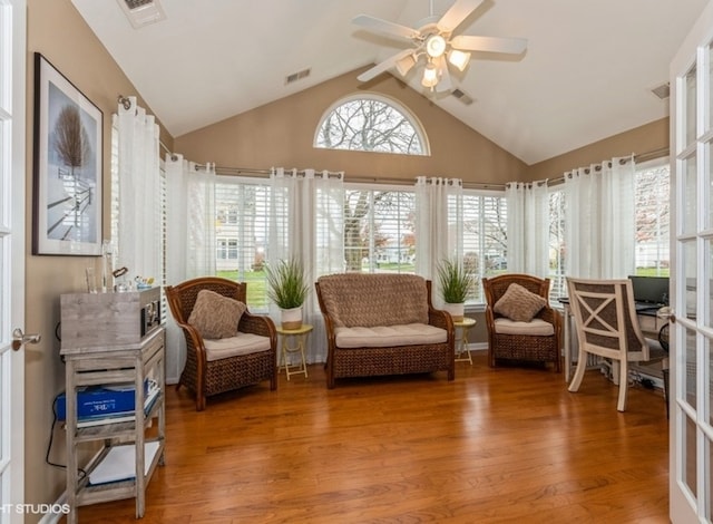 sunroom / solarium with vaulted ceiling and ceiling fan